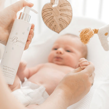 Moisturising baby’s skin with our dewdrops at dawn body lotion